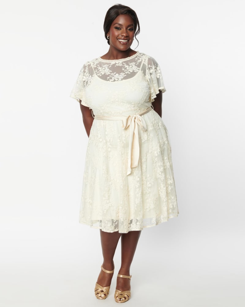 Front of a model wearing a size 2X Unique Vintage Ivory Floral Lace Bridal Swing Dress in White by Unique Vintage. | dia_product_style_image_id:287870